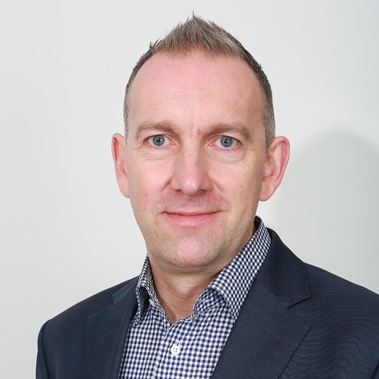 A portrait of Gary Williams, MDM Solution Specialist at QMetrix.