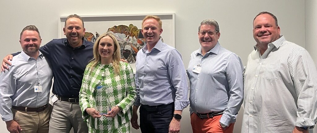 Photo of Corporate Vice President Microsoft Data, AI and Digital Applications Product Marketing Jessica Hawk receiving the 2024 Profisee Global Partner of the Year Award at the Microsoft campus in Redmond, WA.