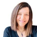 Andrea Wehrung smiles at the camera against a white background.